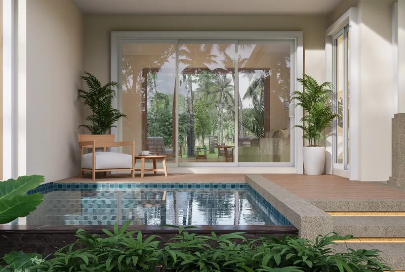 White-framed sliding glass door wall opening to a covered patio and plunge pool with tropical plants