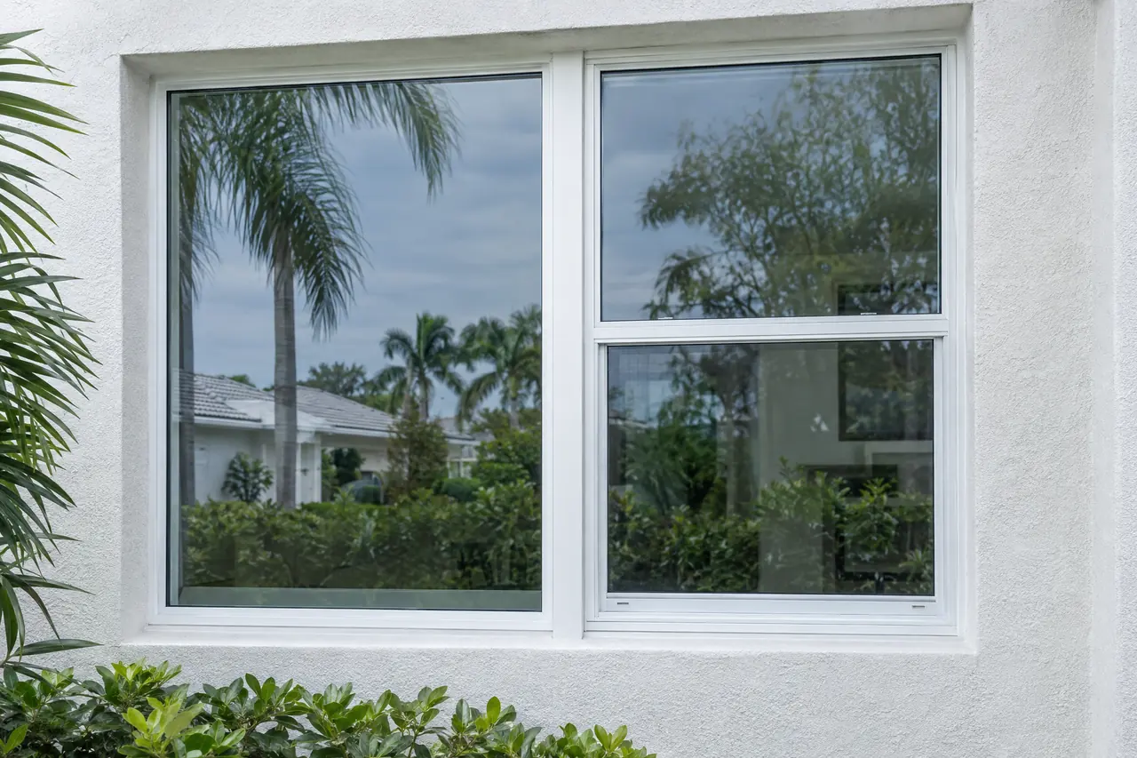 A fixed window and a single-hung window joined by a full-height vertical mullion